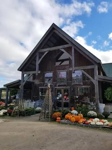 The barn store at Twin Pines Orchards, decorated with pumpkins