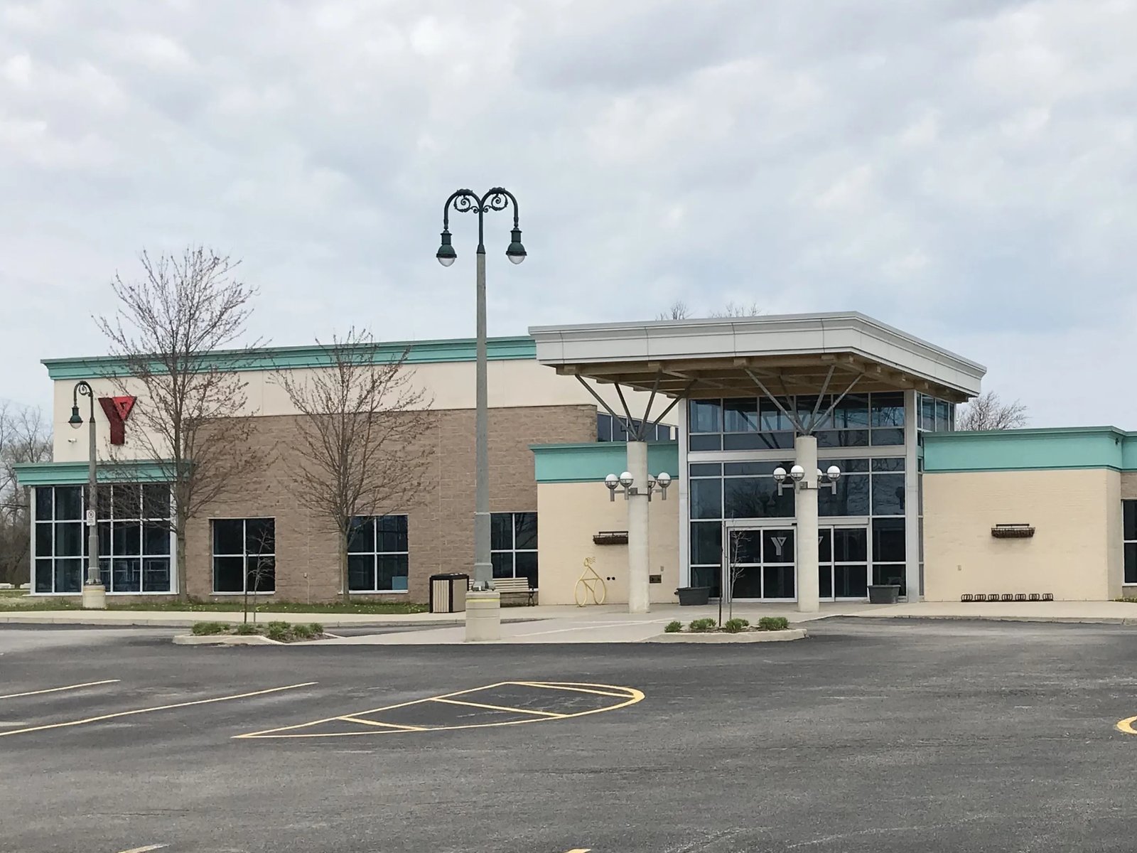 The Petrolia YMCA building exterior, with its entrance canopy and Y sign
