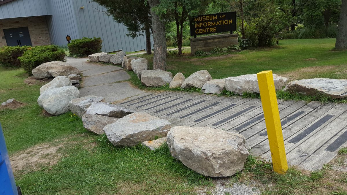 The path to the Arkona Lions Museum and Information Centre at Rock Glen, lined with boulders of fossil-bearing rock
