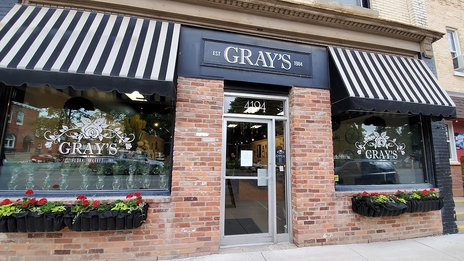 Gray's Floral Market on Petrolia Line: a brick storefront with striped awnings and flower boxes