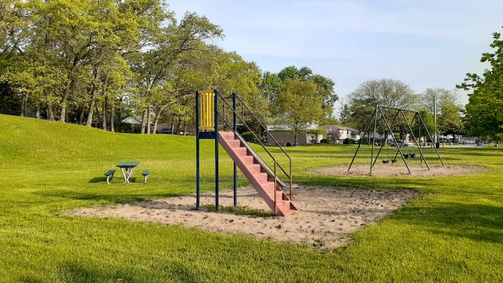 Slide, swings and open green space at Len Park in Sarnia